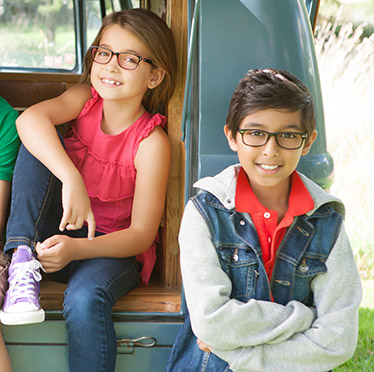 boy and girl wearing glasses
