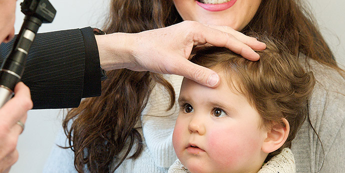 young baby having an eye test